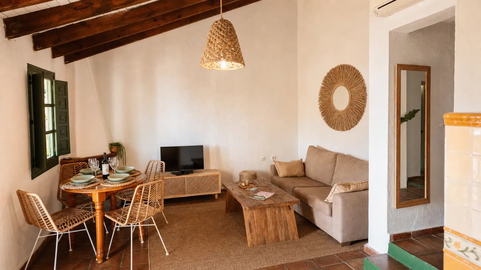Cottage living room with dining table and sofa