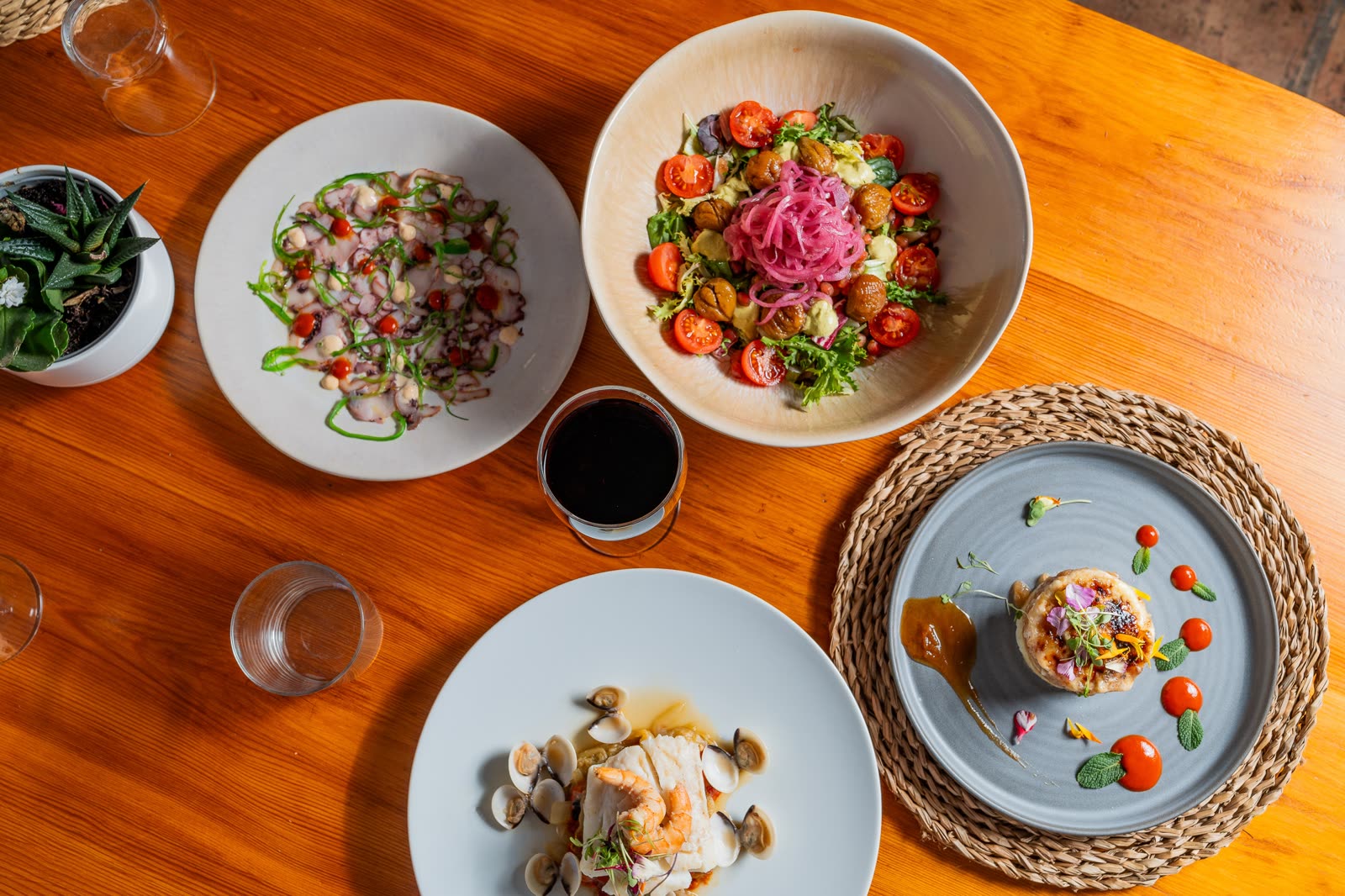 Overhead view of a tasting menu spread at Finca Cantueso restaurant