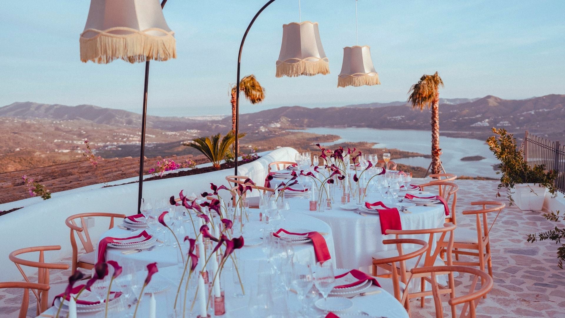 Dinner table set at sunset on the terrace, overlooking the lake